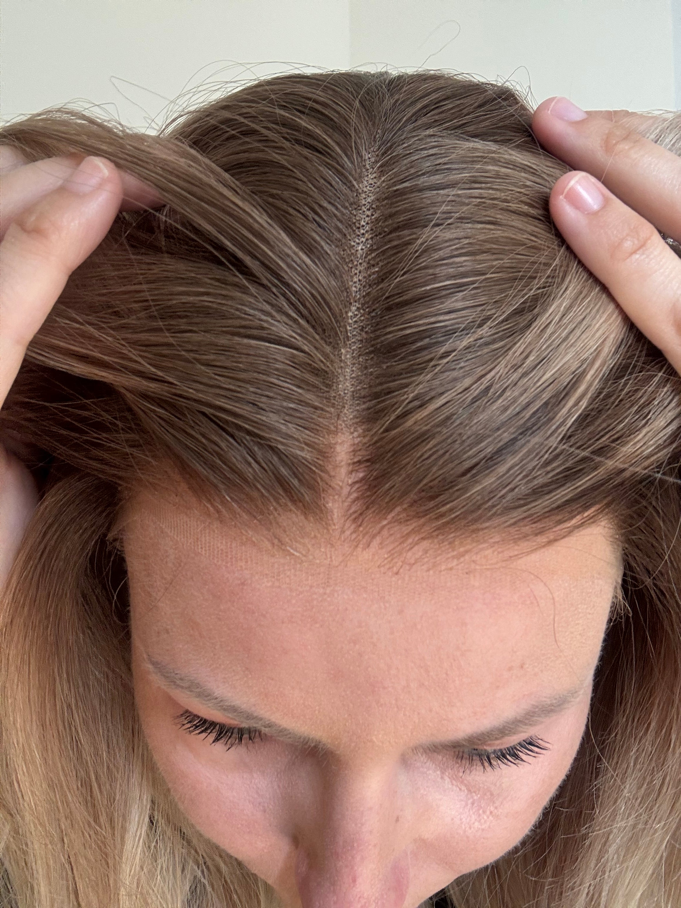 Close up of blonde human hair wig with natural looking HD lace hairline