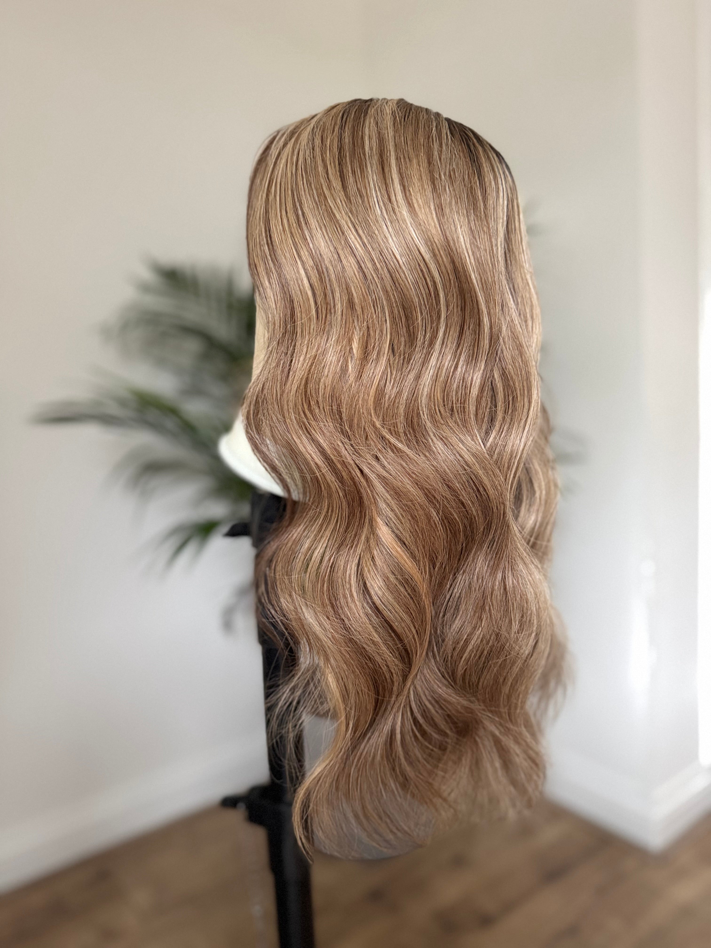 Dimensional brunette human hair wig with softly blended blonde balayage highlights